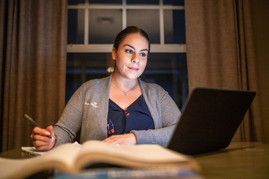 Nurse studying on a laptop
