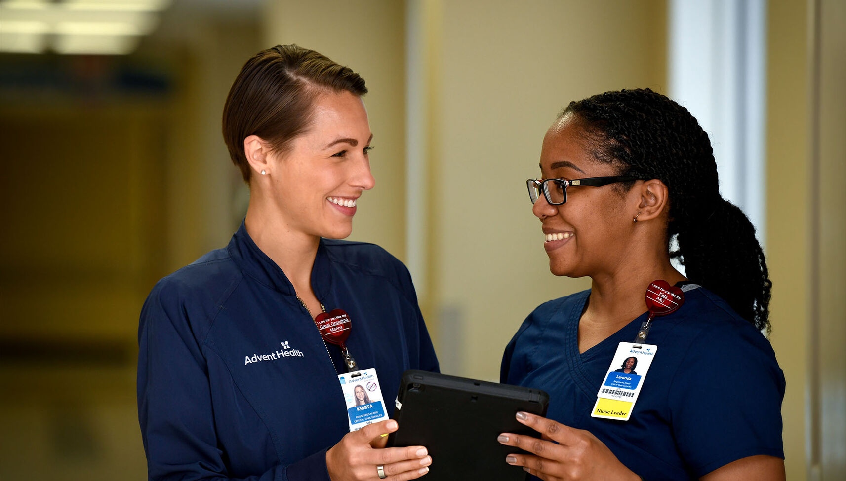 Two young female nurses working together in a hospital