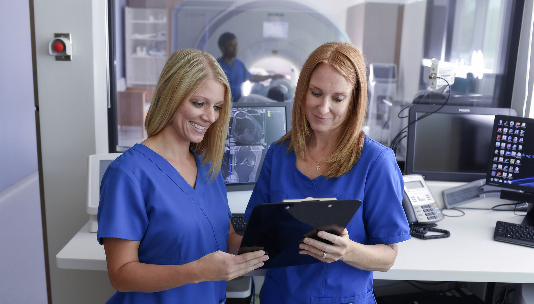 MRI technicians looking at report