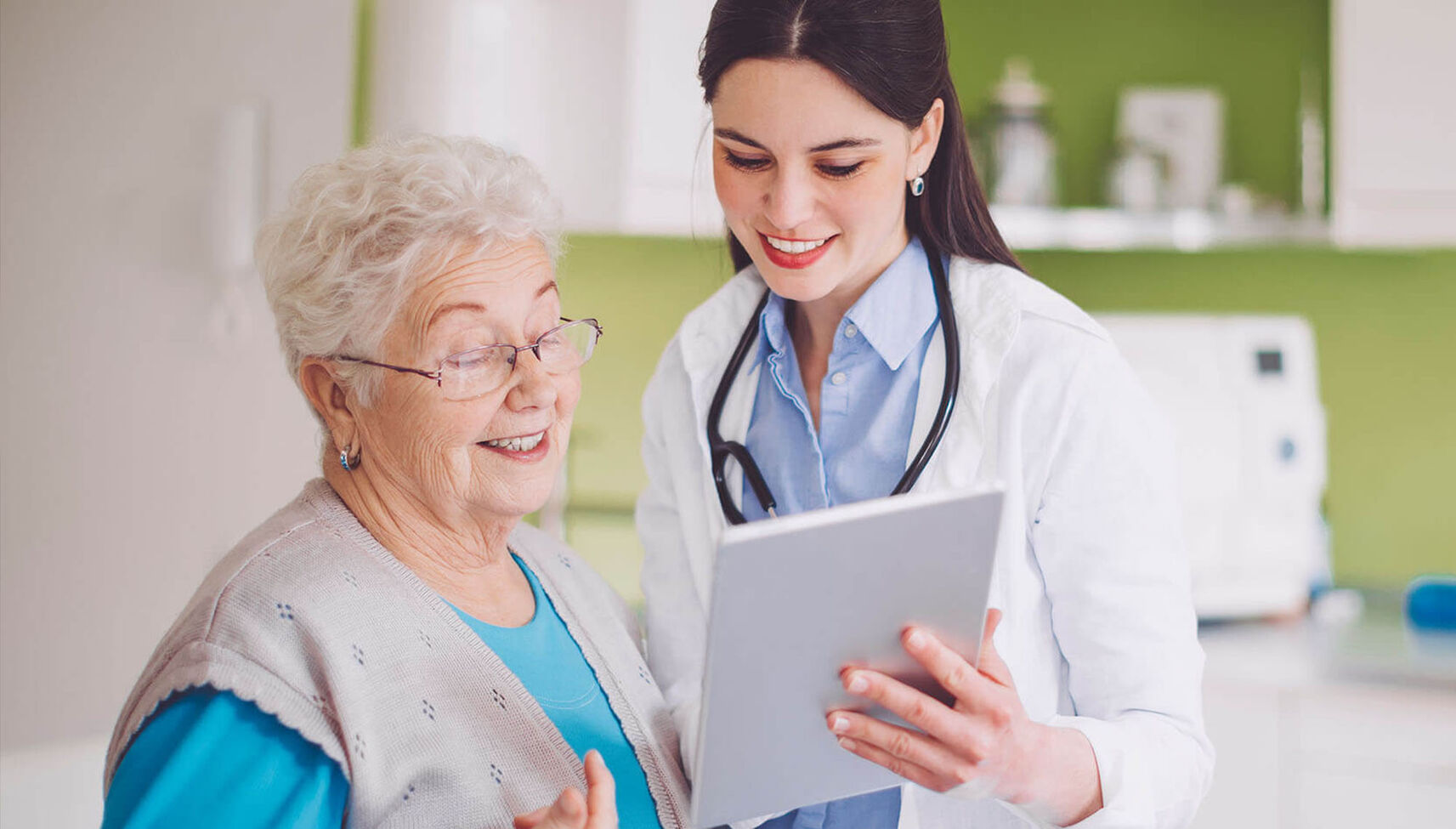 A nurse practitioner reviews a chart with a patient