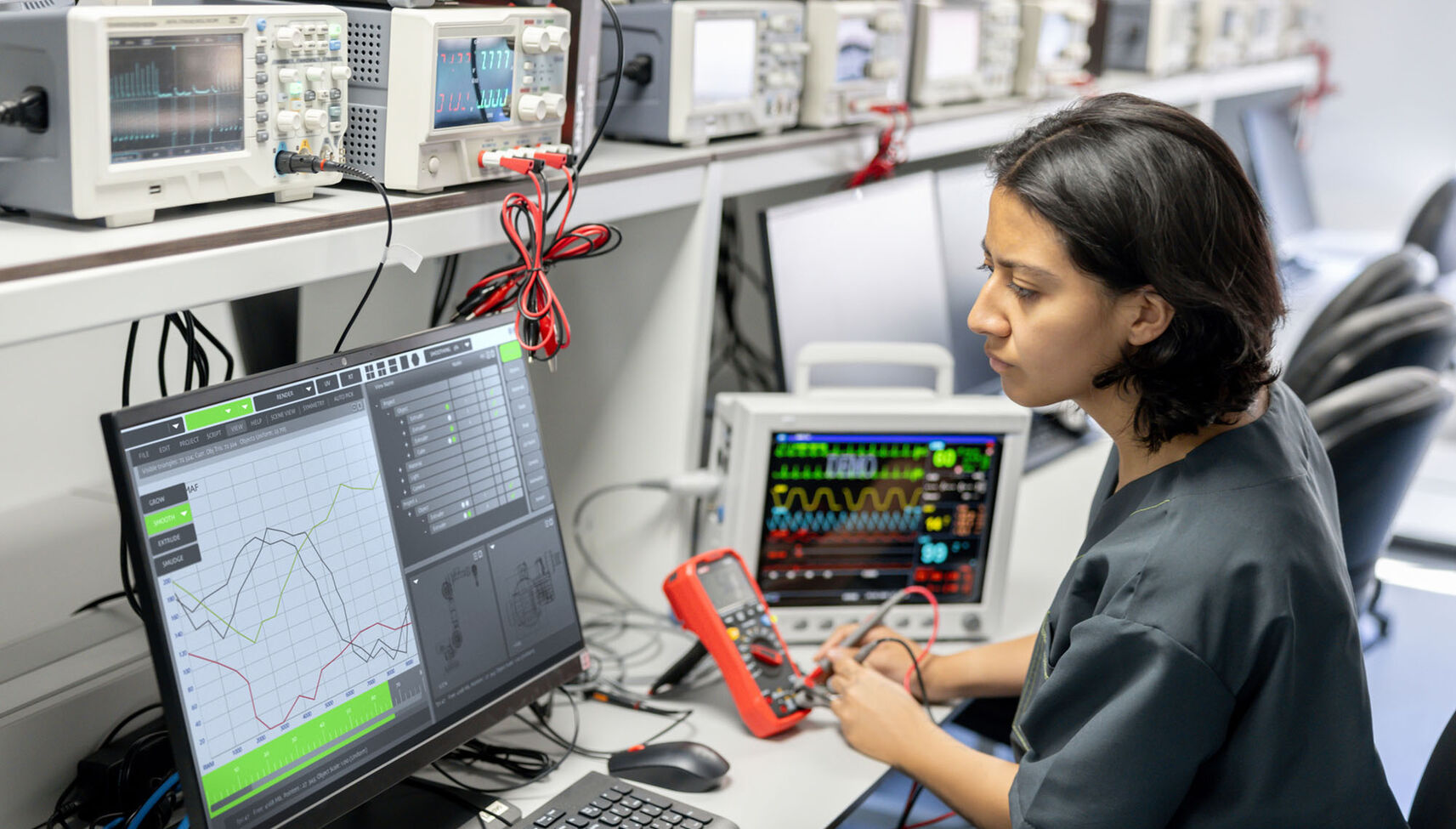 A healthcare technology worker reading a computer screen