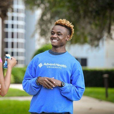 A student in an AHU sweater