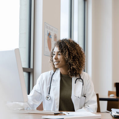 Female Physician using computer