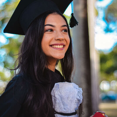 A female student in graduation regalia