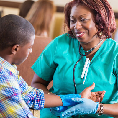 nurse examining boy
